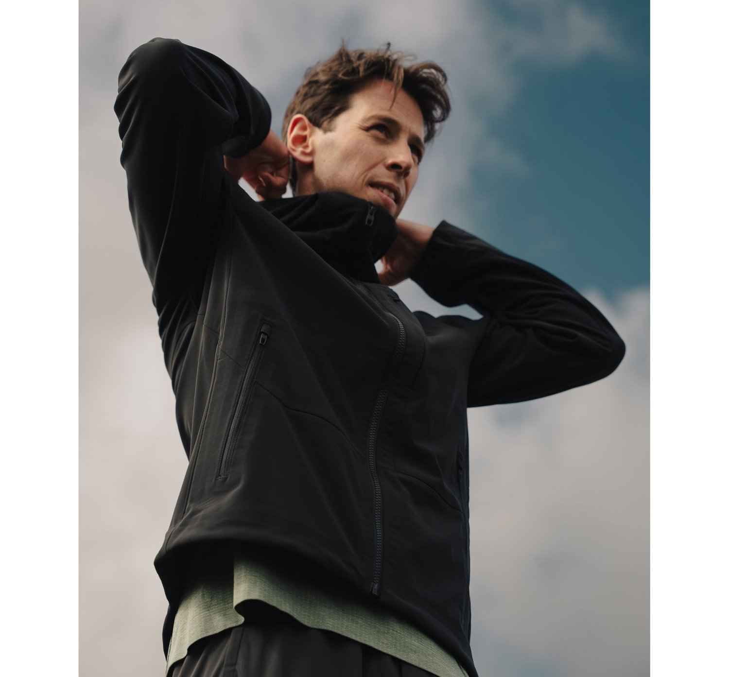 Lululemon Outerwear: Ollie in black running jacket against sky